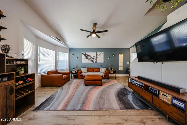 a living room with furniture and a flat screen tv