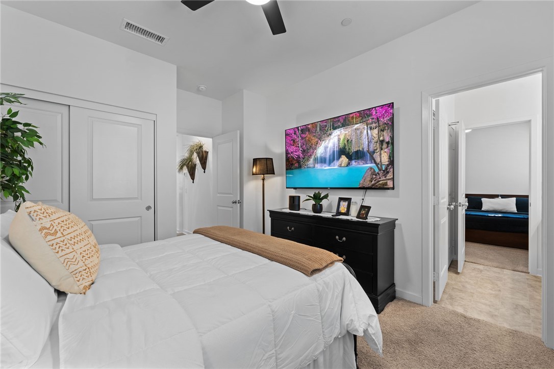 36938 Frantoio Street Beaumont, CA 92223 - Photo 26 of 35 a bedroom with a bed and a flat screen tv