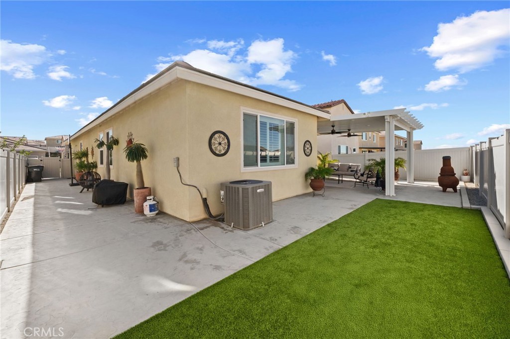 36938 Frantoio Street Beaumont, CA 92223 - Photo 32 of 35 a view of an house with backyard space and a patio