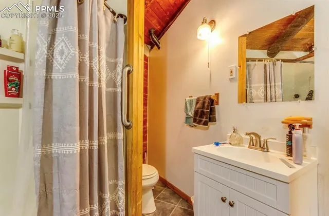 a bedroom with a bed and a night stand