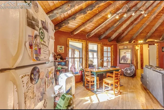 a living room with furniture a flat screen tv and a large window