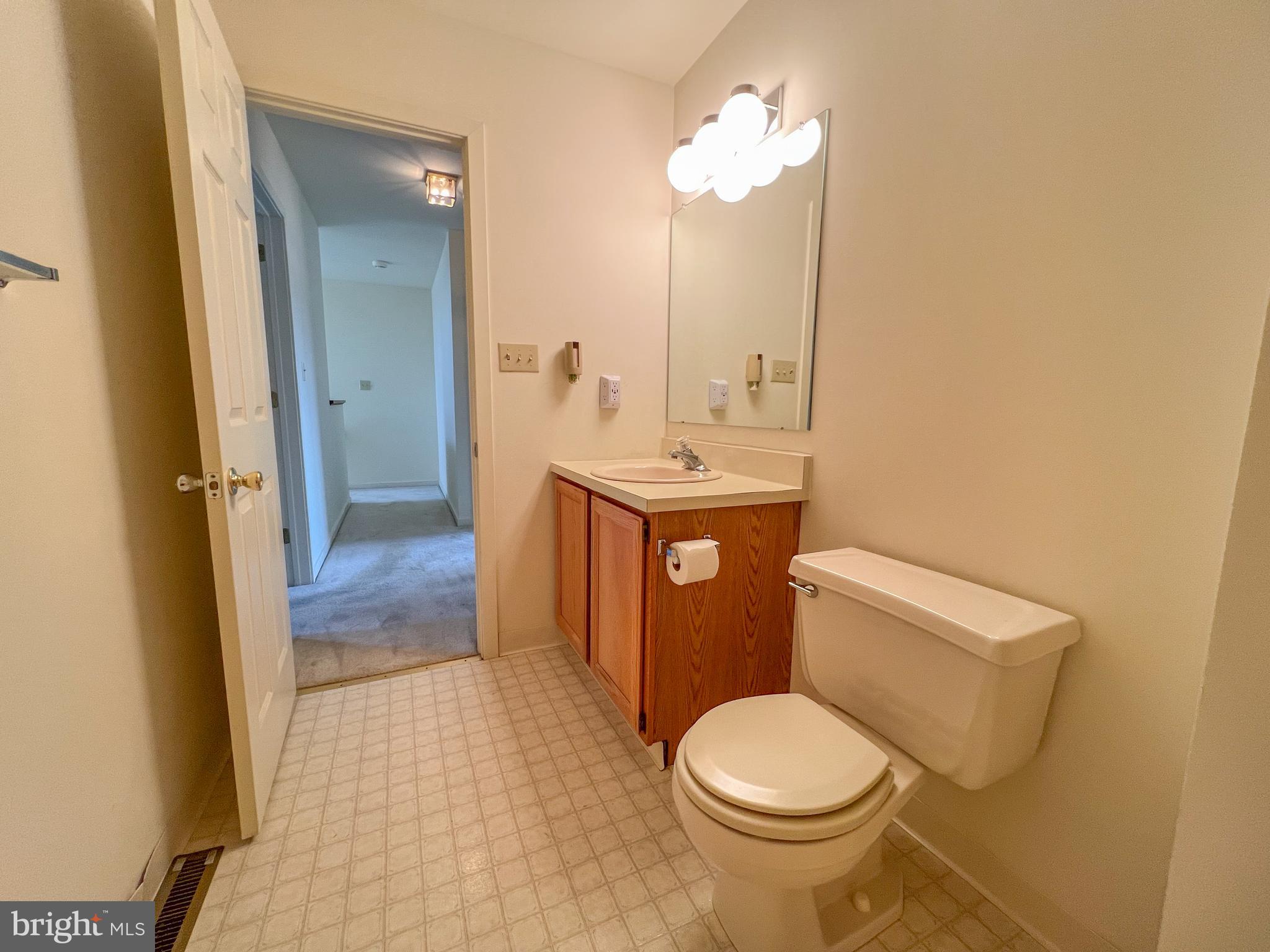 370 Chickory Way Newark, DE 19711 - Photo 26 of 36 a bathroom with a granite countertop toilet sink and mirror