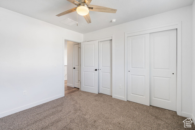 3456 South Linden Way Syracuse, UT 84075 - Photo 28 of 50 Bedroom featuring two closets, carpet flooring, baseboards, and ceiling fan