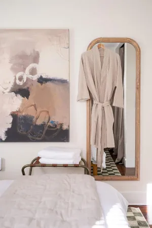 a bathroom with a granite countertop sink a mirror a vanity and bathtub