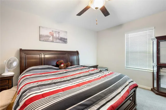 a bedroom with bed and a window