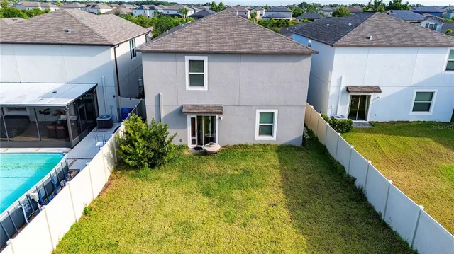 a aerial view of a house with swimming pool