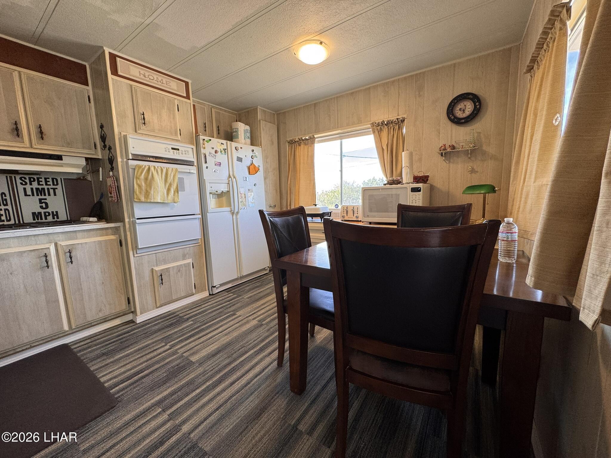 587 West Pyramid Street Quartzsite, AZ 85346 - Photo 16 of 46 a dining room with furniture and window
