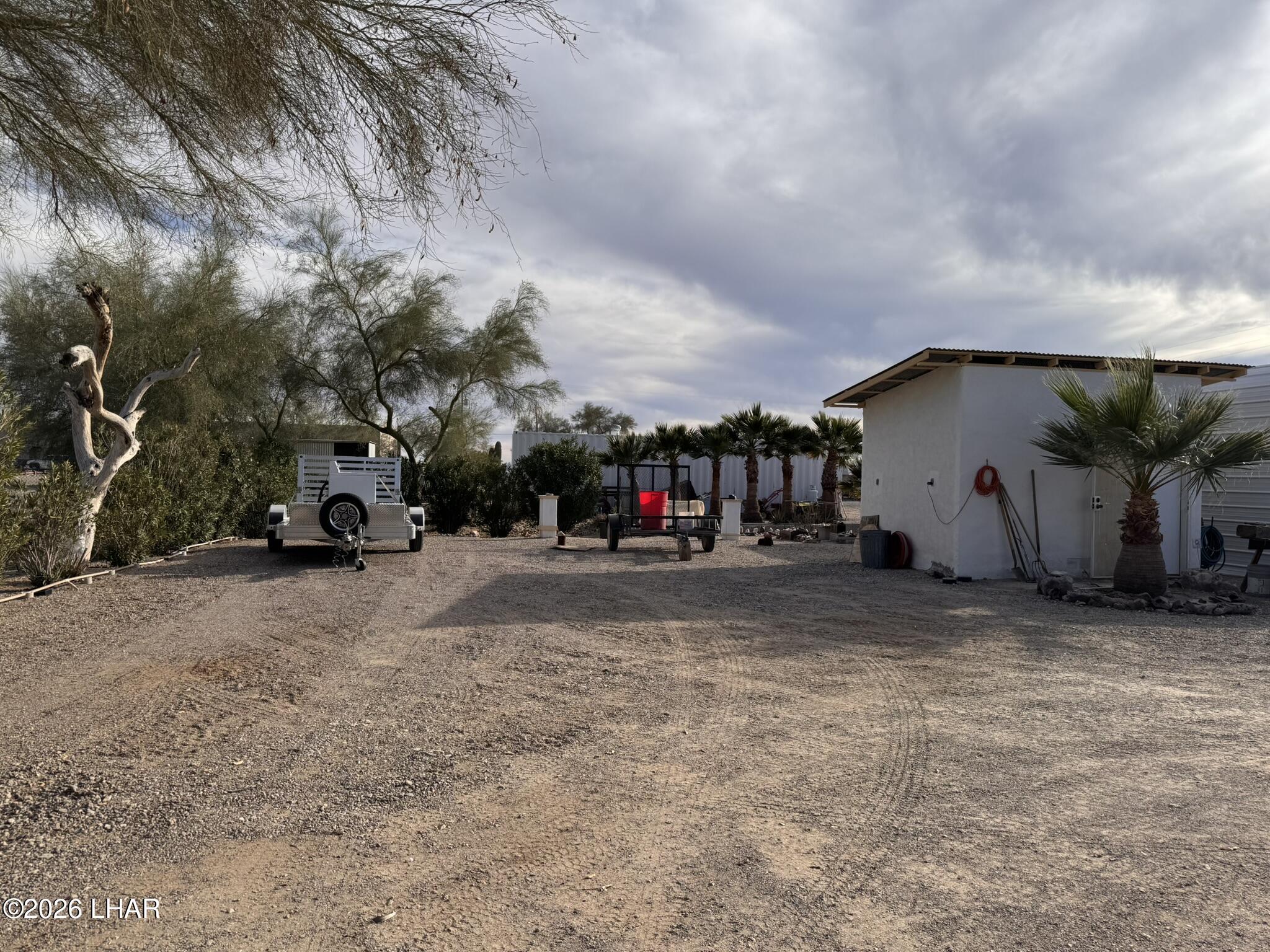 587 West Pyramid Street Quartzsite, AZ 85346 - Photo 20 of 46 a car parked in front of a house