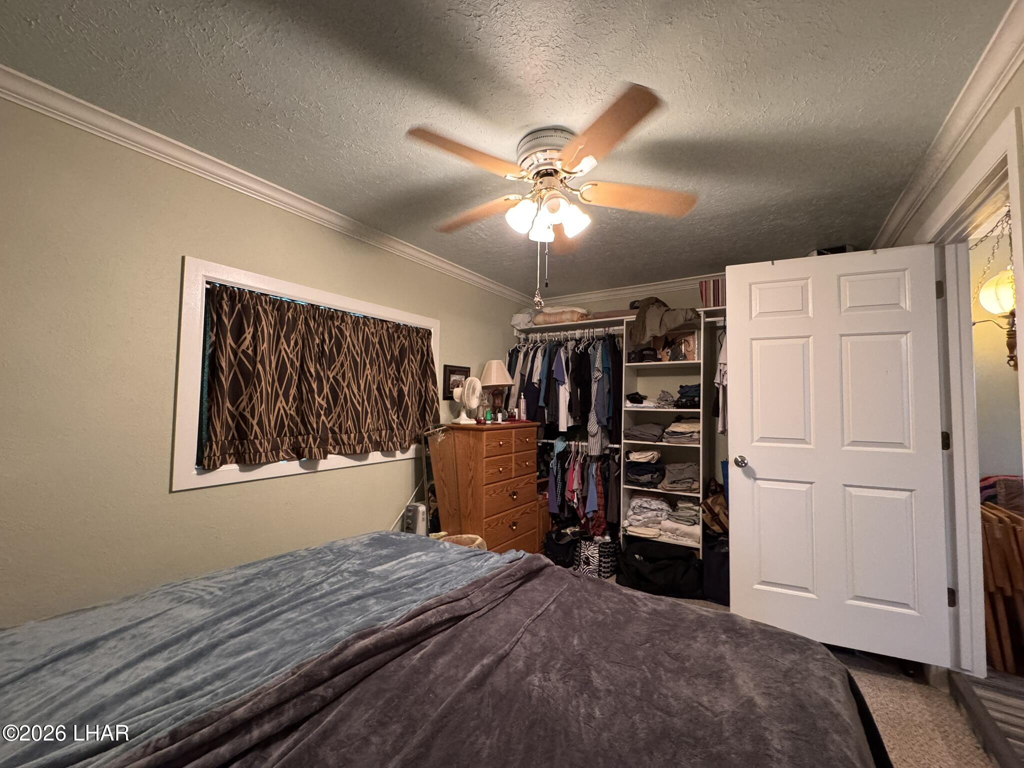 587 West Pyramid Street Quartzsite, AZ 85346 - Photo 27 of 46 a view of a bedroom with closet and cabinet