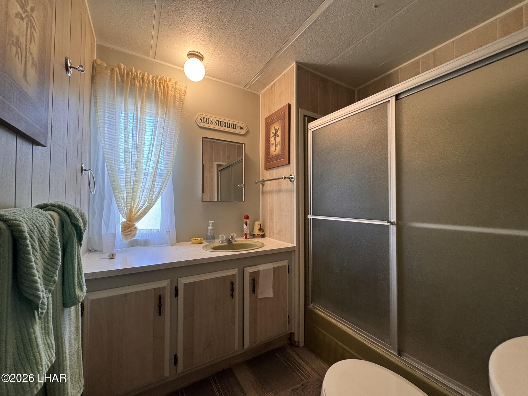 587 West Pyramid Street Quartzsite, AZ 85346 - Photo 9 of 46 a bathroom with a sink mirror toilet and shower