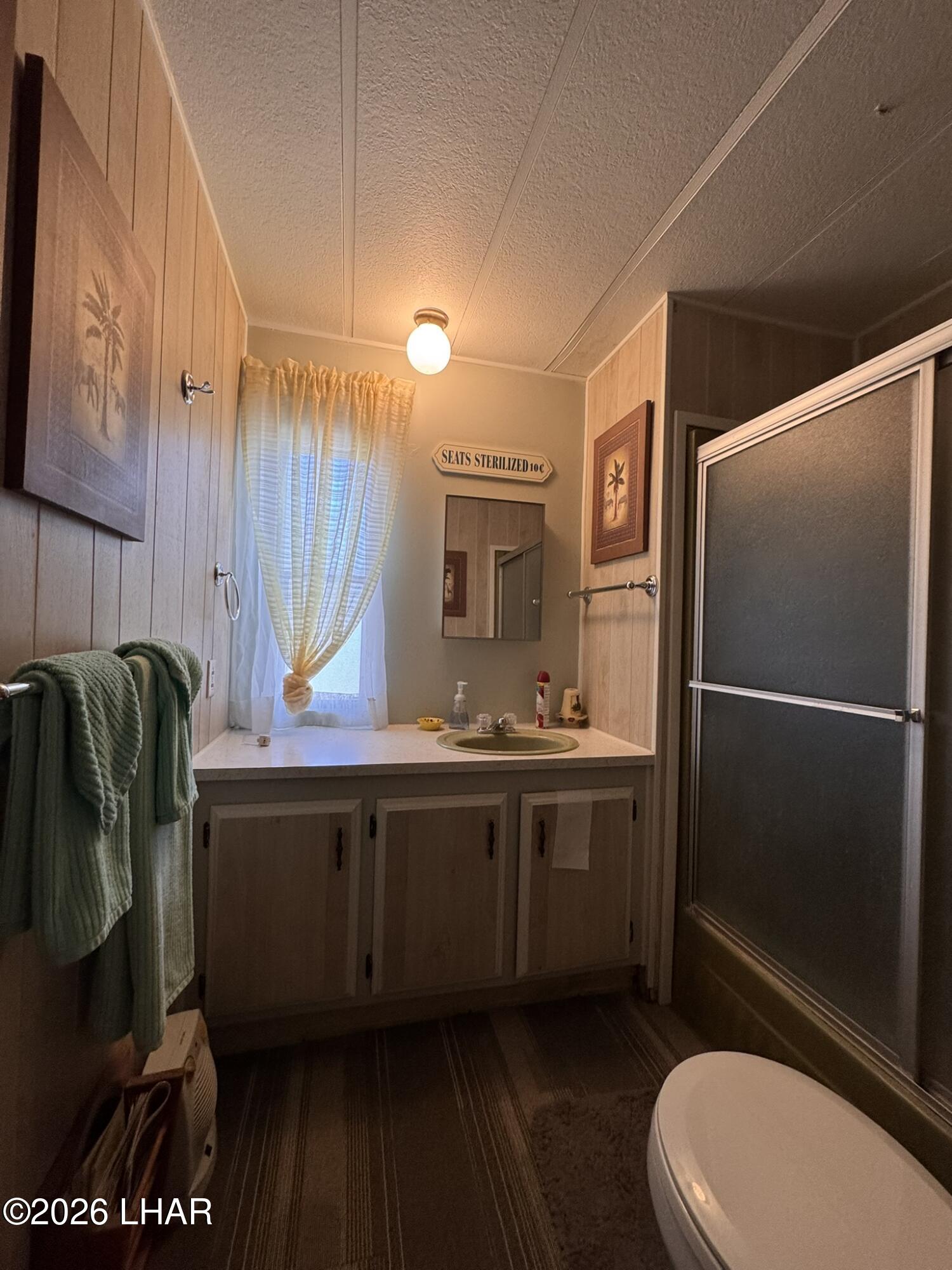 587 West Pyramid Street Quartzsite, AZ 85346 - Photo 10 of 46 a bathroom with a sink a toilet and shower