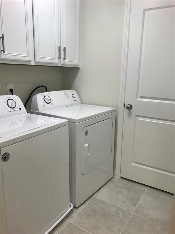 2680 Mead Avenue St. Cloud, FL 34771 - Photo 13 of 35 a utility room with dryer and washer