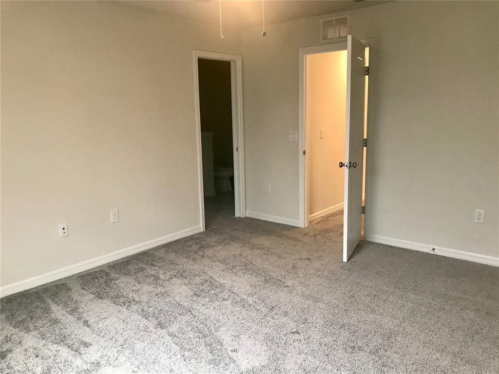 2680 Mead Avenue St. Cloud, FL 34771 - Photo 22 of 35 an empty room with closet and a bathroom