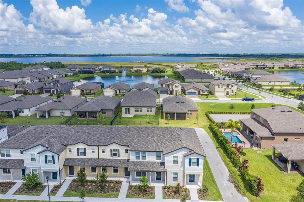 2680 Mead Avenue St. Cloud, FL 34771 - Photo 31 of 35 an aerial view of residential houses with outdoor space and a lake view in back