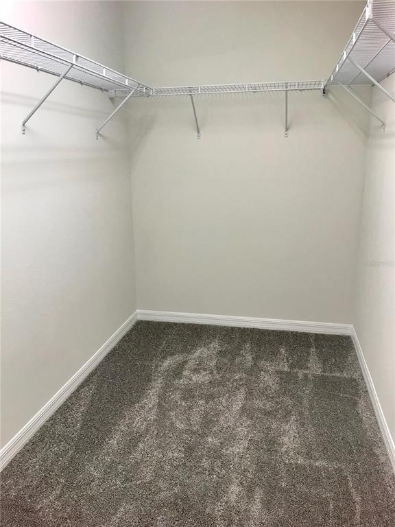 2680 Mead Avenue St. Cloud, FL 34771 - Photo 10 of 35 a view of a room with racks on the wall