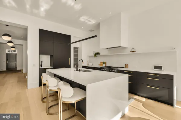 a kitchen with a stove and a sink