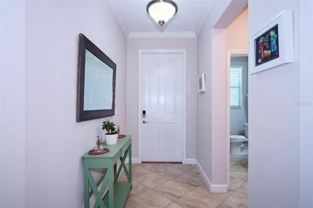 a bathroom with mirror and vanity