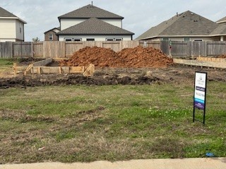 310 Amy Street Angleton, TX 77515 - Photo 2 of 26 a front view of a house with a yard