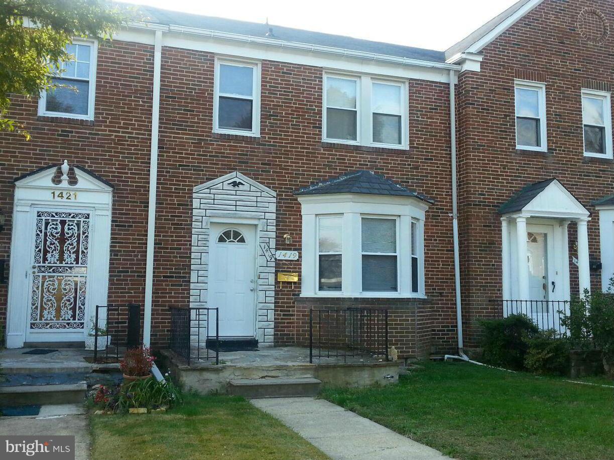 1419 Northgate Road Baltimore, MD 21218 - Photo 1 of 8 a front view of a house with garden
