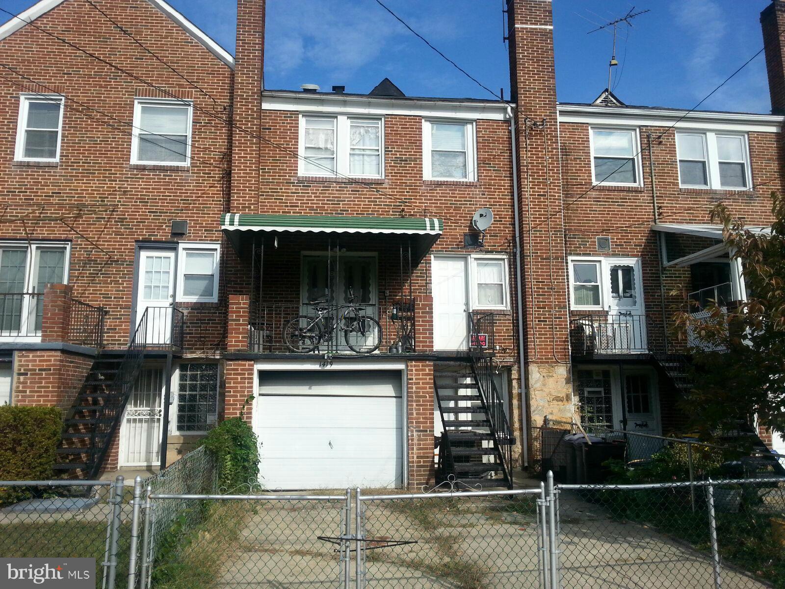 1419 Northgate Road Baltimore, MD 21218 - Photo 5 of 8 a front view of a house with garden