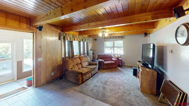 a view of entryway livingroom and hall with wooden floor