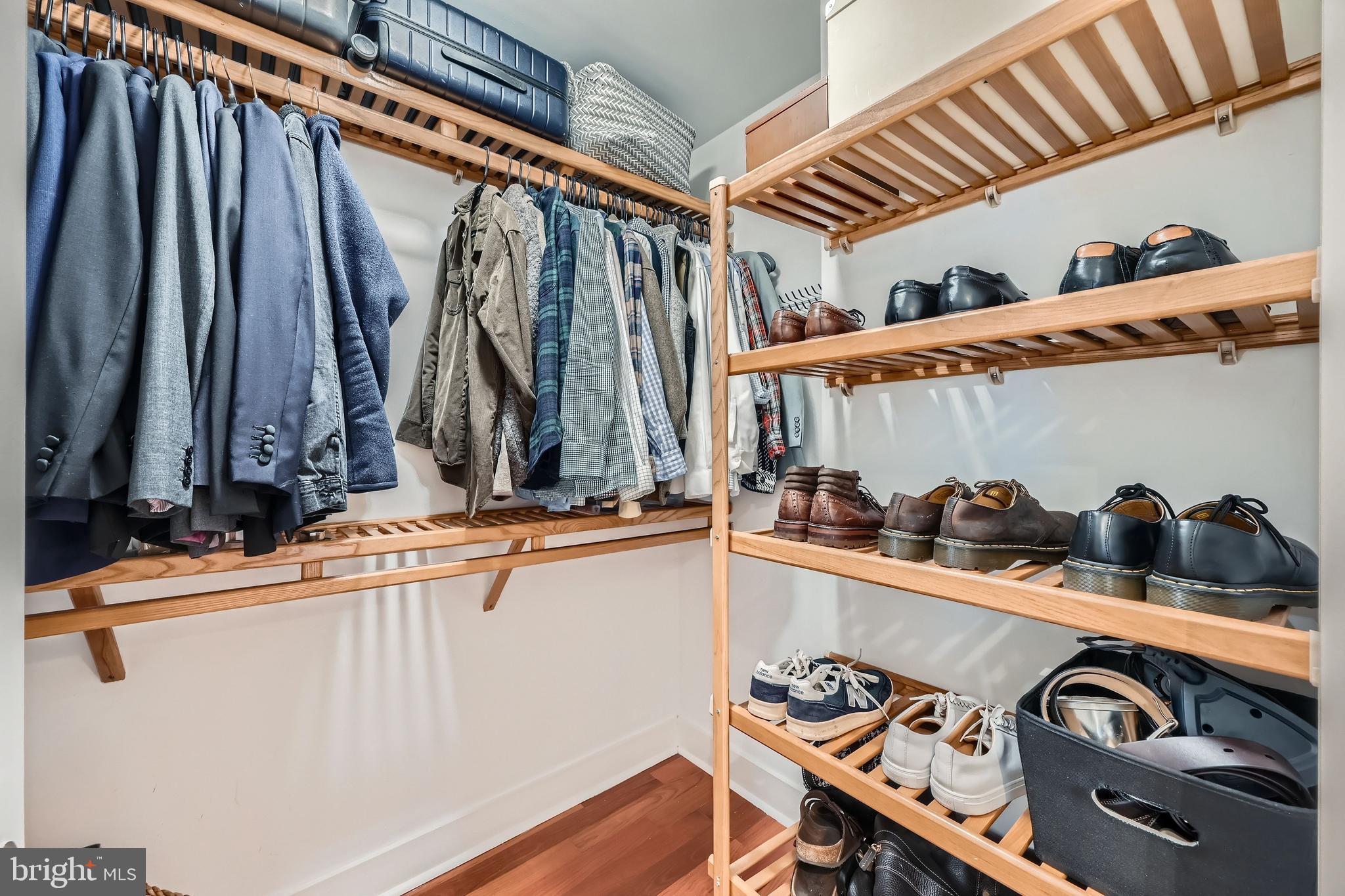 1400 Lancaster Street, Unit 303 Baltimore, MD 21231 - Photo 18 of 36 a view of walk in closet with clothes and shoes