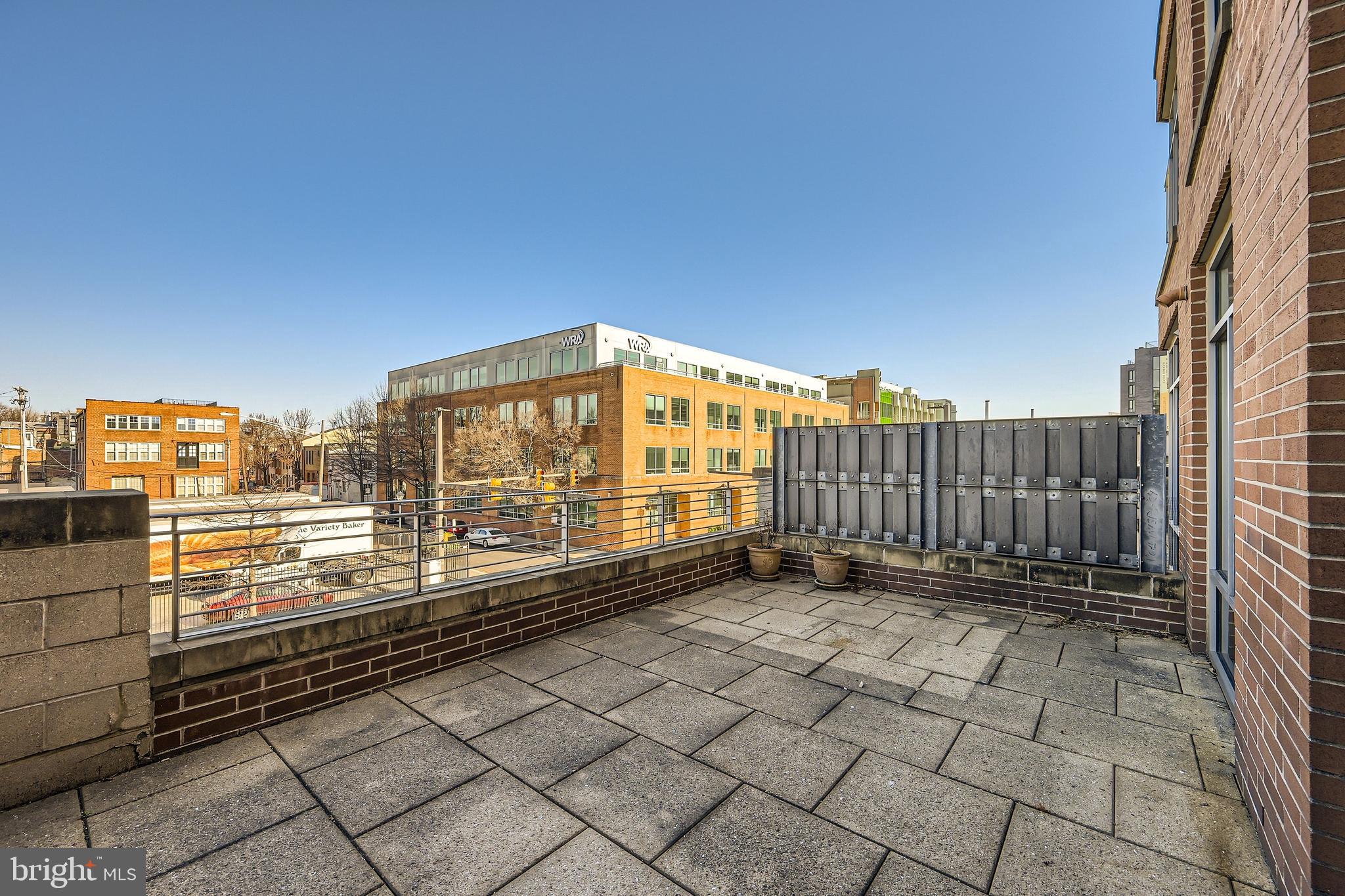 1400 Lancaster Street, Unit 303 Baltimore, MD 21231 - Photo 23 of 36 a view of a balcony with city view