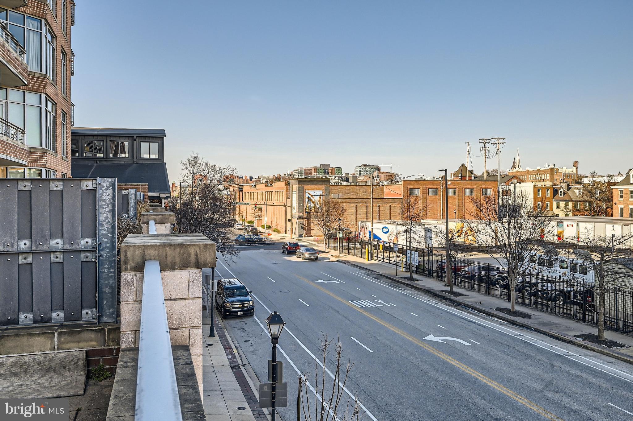 1400 Lancaster Street, Unit 303 Baltimore, MD 21231 - Photo 27 of 36 a city street with tall buildings