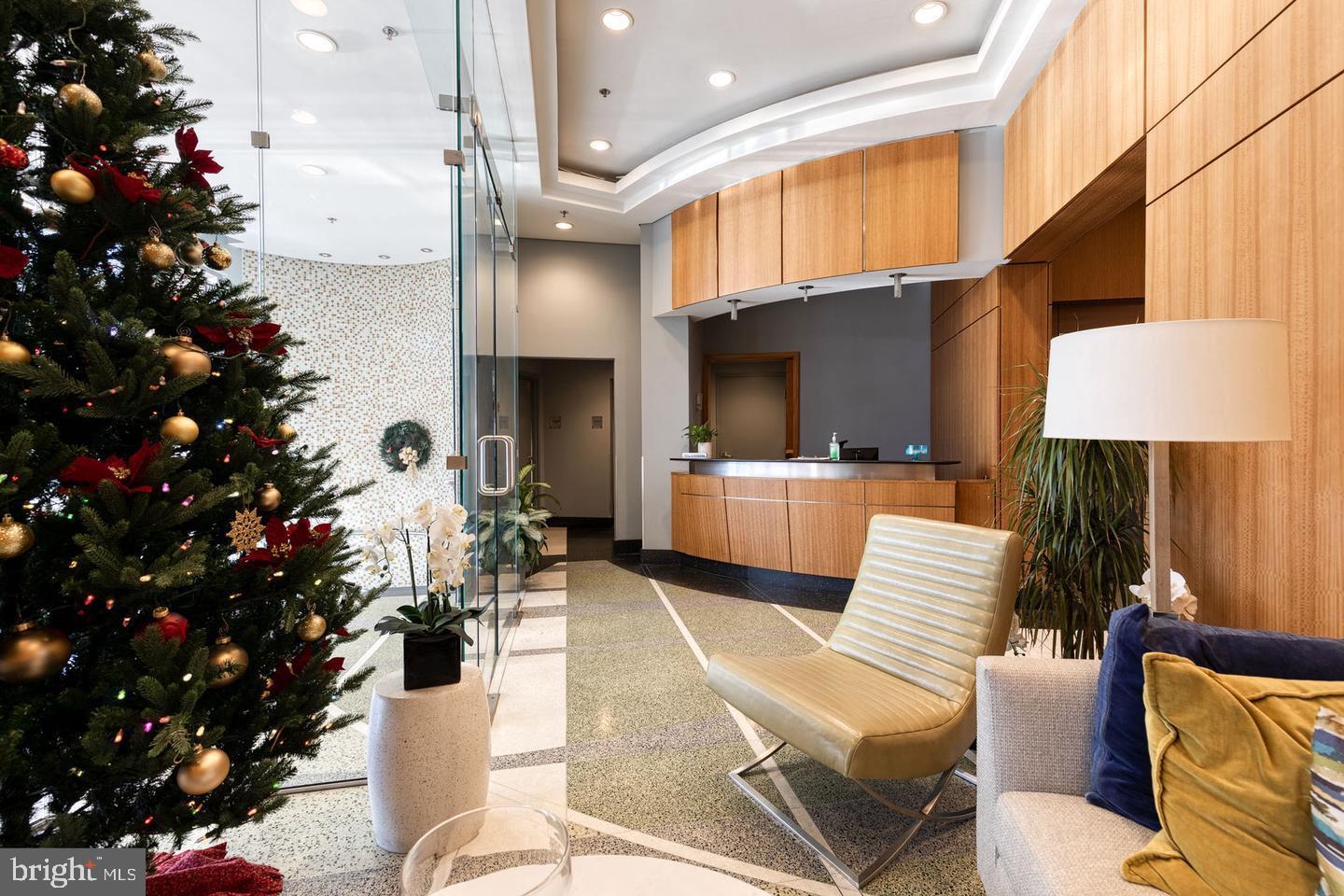 1400 Lancaster Street, Unit 303 Baltimore, MD 21231 - Photo 32 of 36 a living room with furniture flowerpot and a chandelier