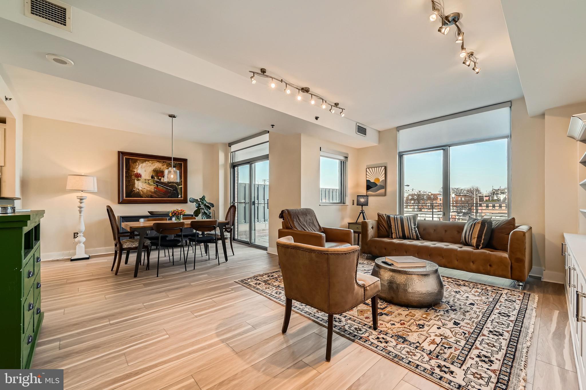 1400 Lancaster Street, Unit 303 Baltimore, MD 21231 - Photo 4 of 36 a living room with furniture and wooden floor