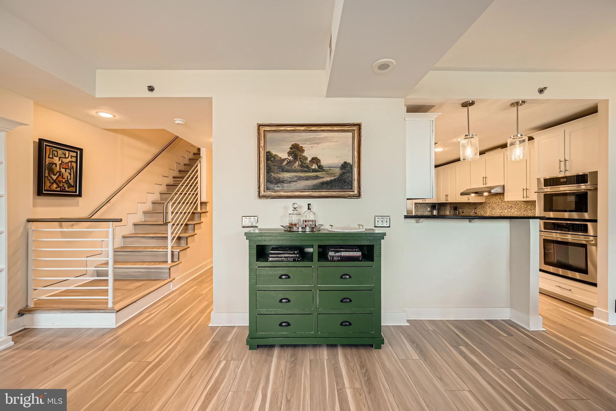 1400 Lancaster Street, Unit 303 Baltimore, MD 21231 - Photo 6 of 36 a view of a hallway with cabinet and cabinet
