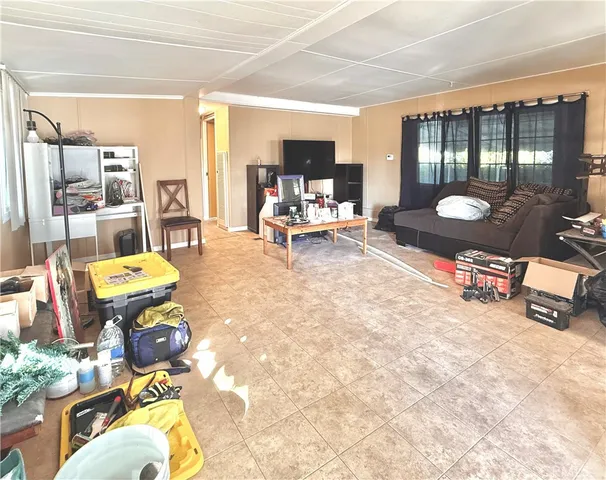 a living room filled with furniture and a table