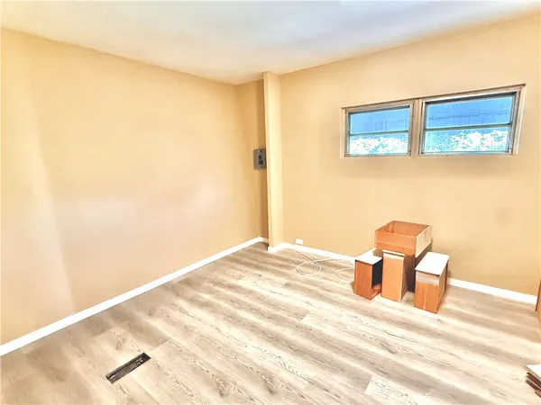 a view of a bedroom with a bed and chair