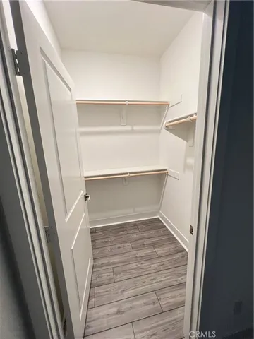 a view of an empty walk in closet