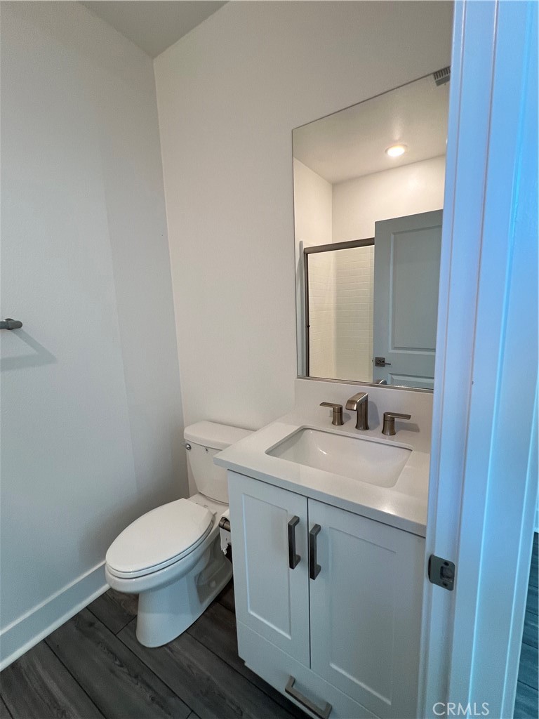 124 Sash Irvine, CA 92618 - Photo 3 of 16 a bathroom with a toilet a sink and mirror