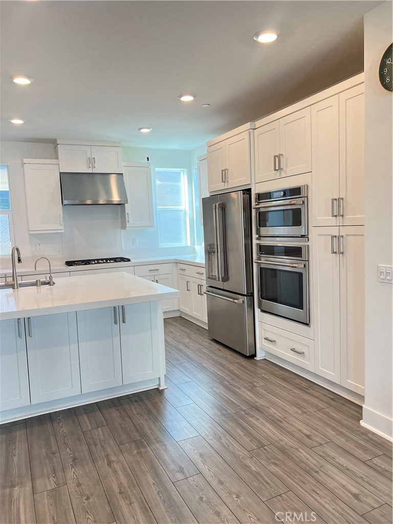 124 Sash Irvine, CA 92618 - Photo 6 of 16 a kitchen with stainless steel appliances a refrigerator sink and microwave