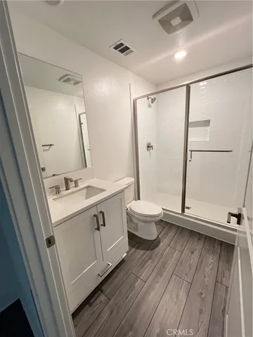 a bathroom with a double vanity sink and mirror