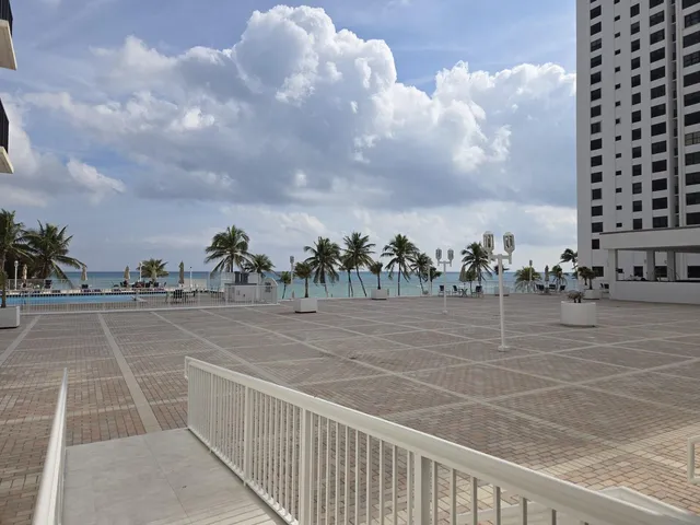 a room with lots of furniture and view of living room