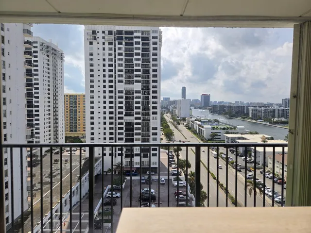 a view of a balcony with wooden floor