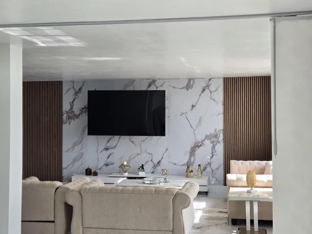 a bathroom with a sink a mirror and a shower