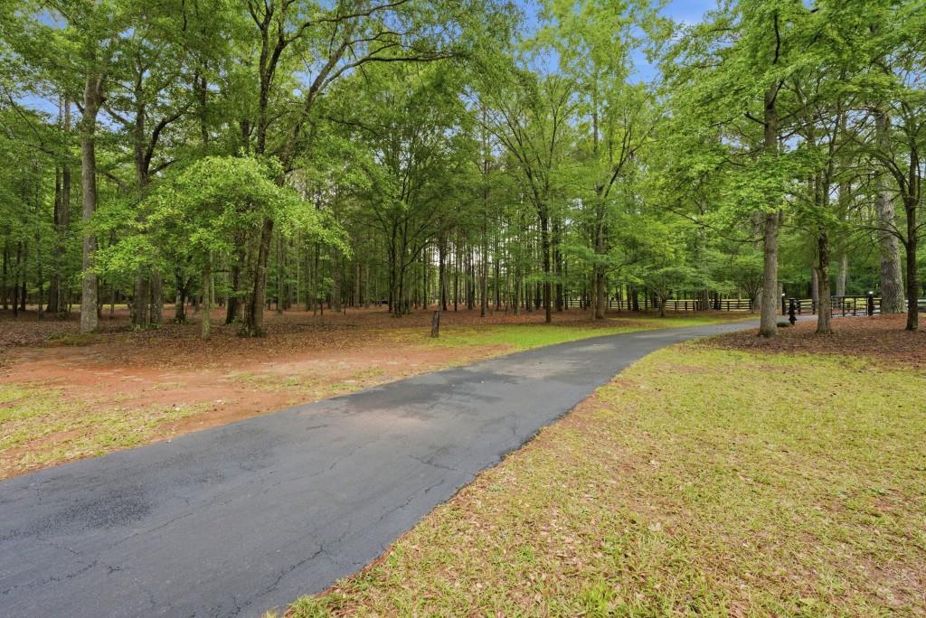 542 Knox Chapel Road Social Circle, GA 30025 - Photo 51 of 52 a swimming pool with outdoor seating and yard