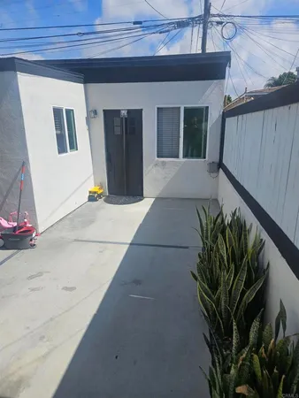 a potted plant sitting in front of a house