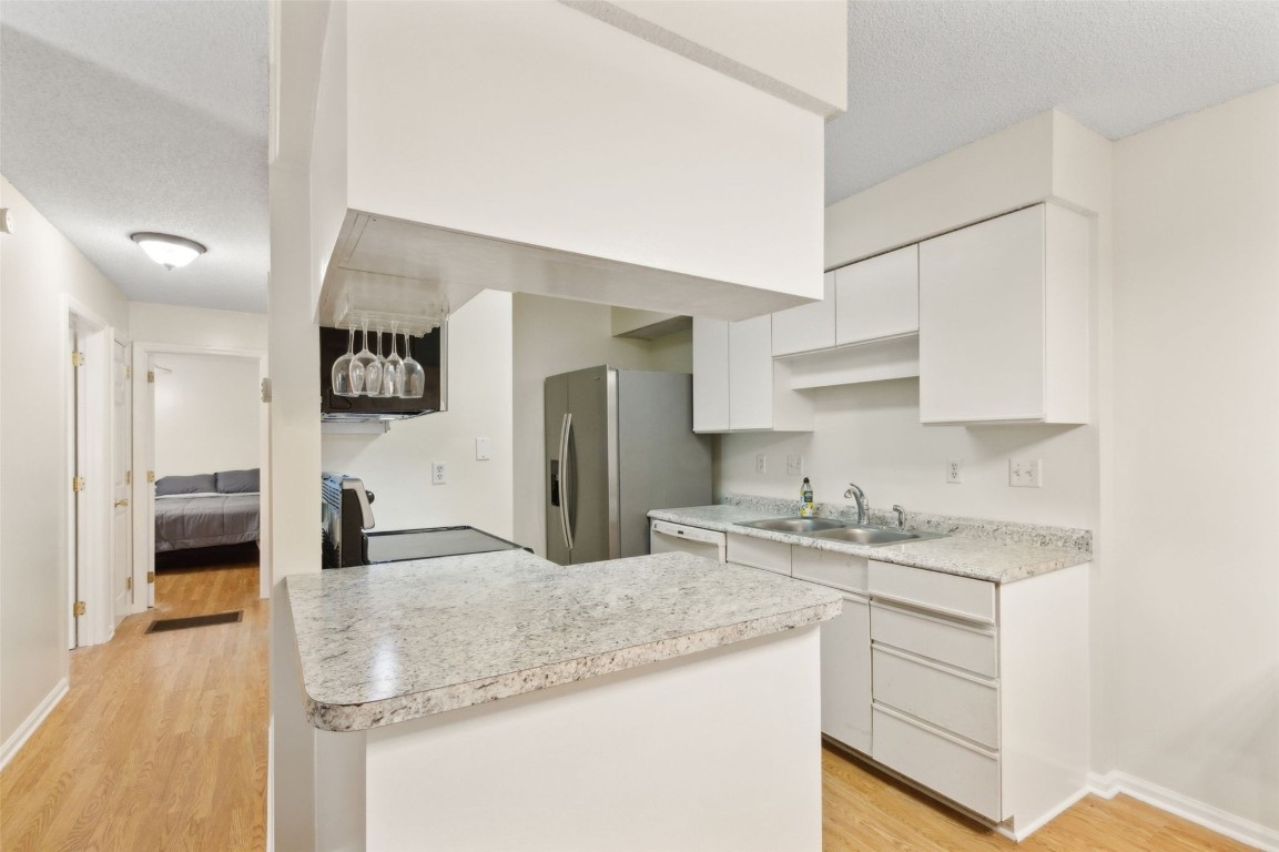 2583 Forest Ridge Drive, Unit N3 Fernandina Beach, FL 32034 - Photo 14 of 34 a kitchen with a sink refrigerator and cabinets