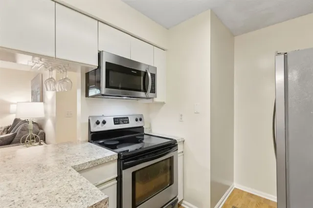 a kitchen with a stove and a microwave