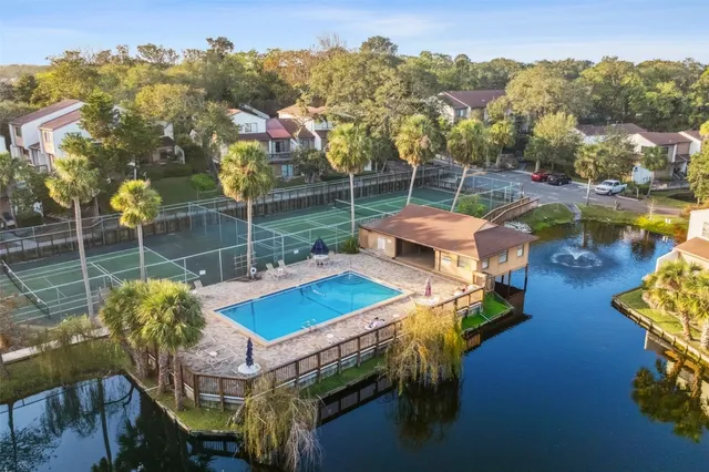a view of a swimming pool with a patio
