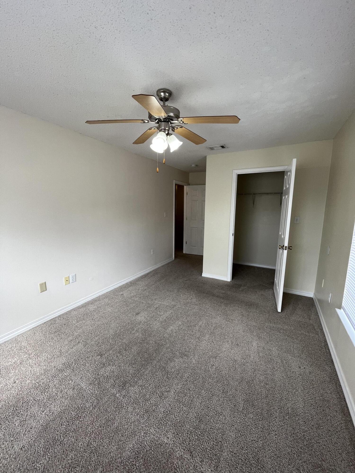 204 Johnson Court Crestview, FL 32536 - Photo 14 of 17 a view of an empty room with a ceiling fan