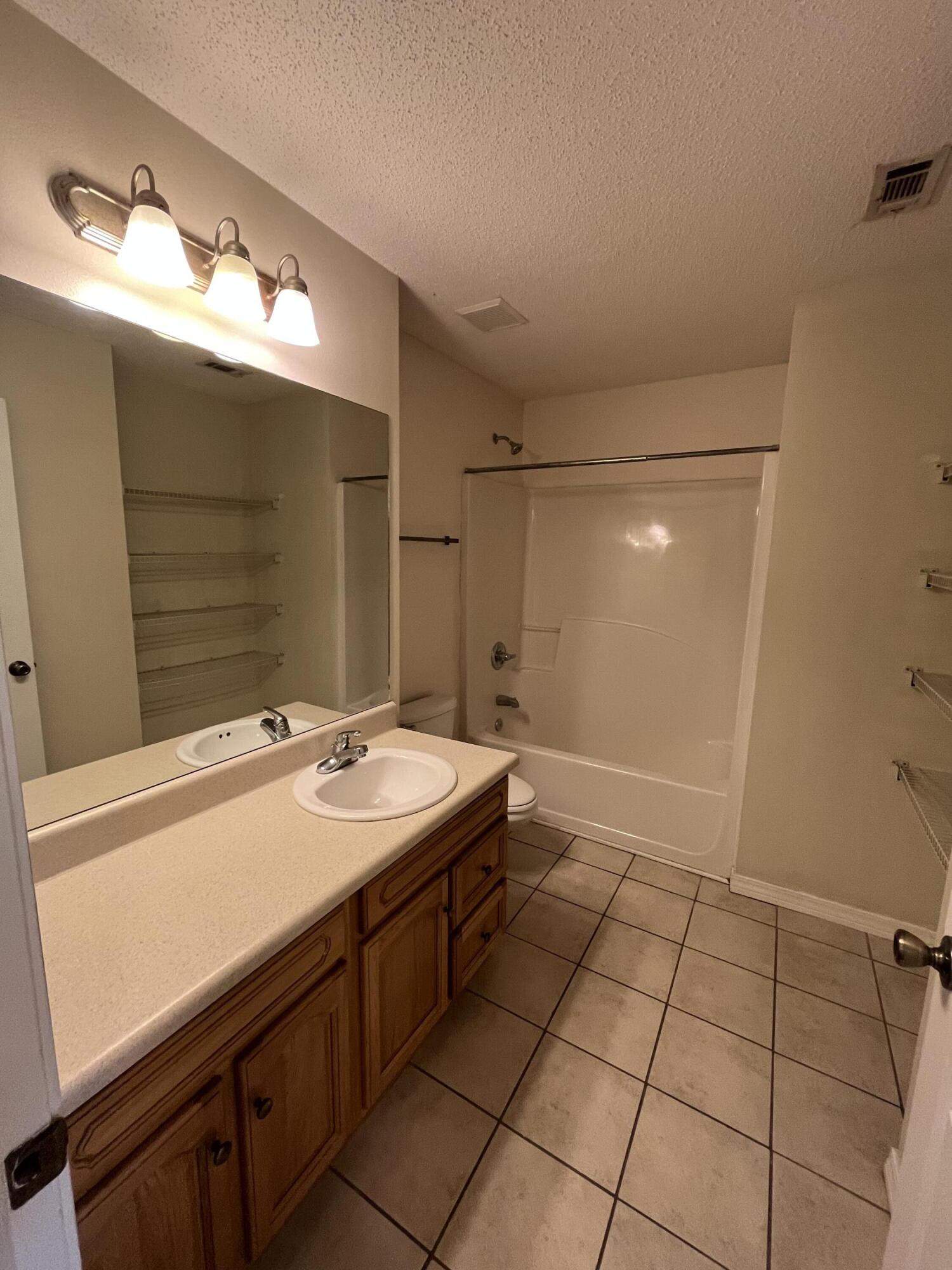 204 Johnson Court Crestview, FL 32536 - Photo 15 of 17 a bathroom with a sink a vanity and a mirror