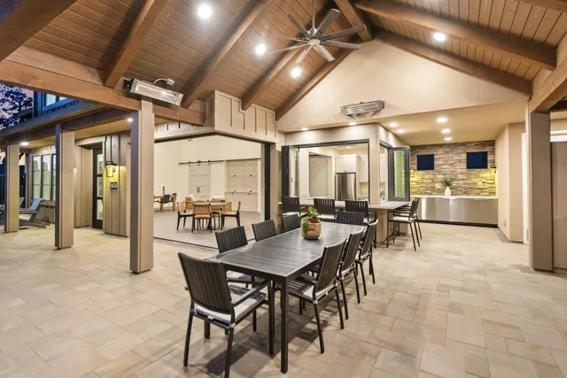 a view of a dining hall with lots of furniture and a chandelier