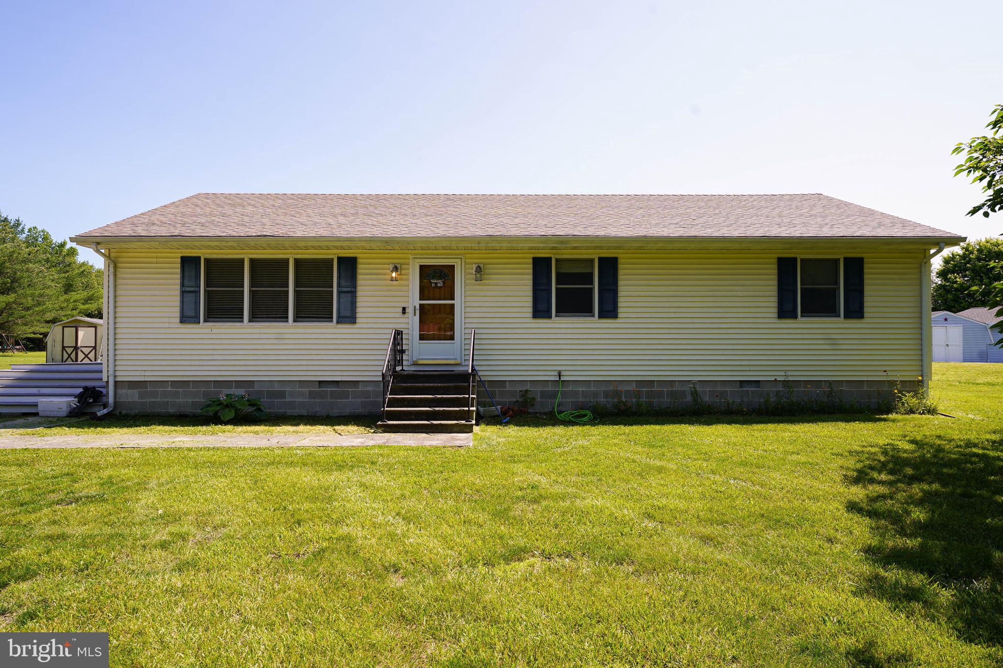 a swimming pool with outdoor seating and yard