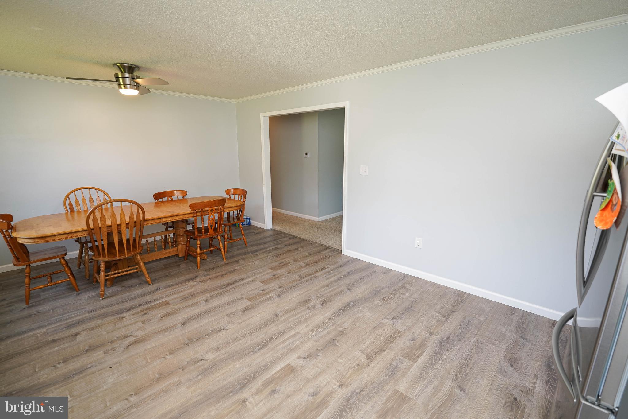 10564 Waller Road Laurel, DE 19956 - Photo 12 of 33 a dining room with furniture and wooden floor